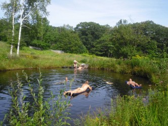 Summer swimming pond floating Frog Meadow New England's Best All Male Gay Resort in Southern Vermont